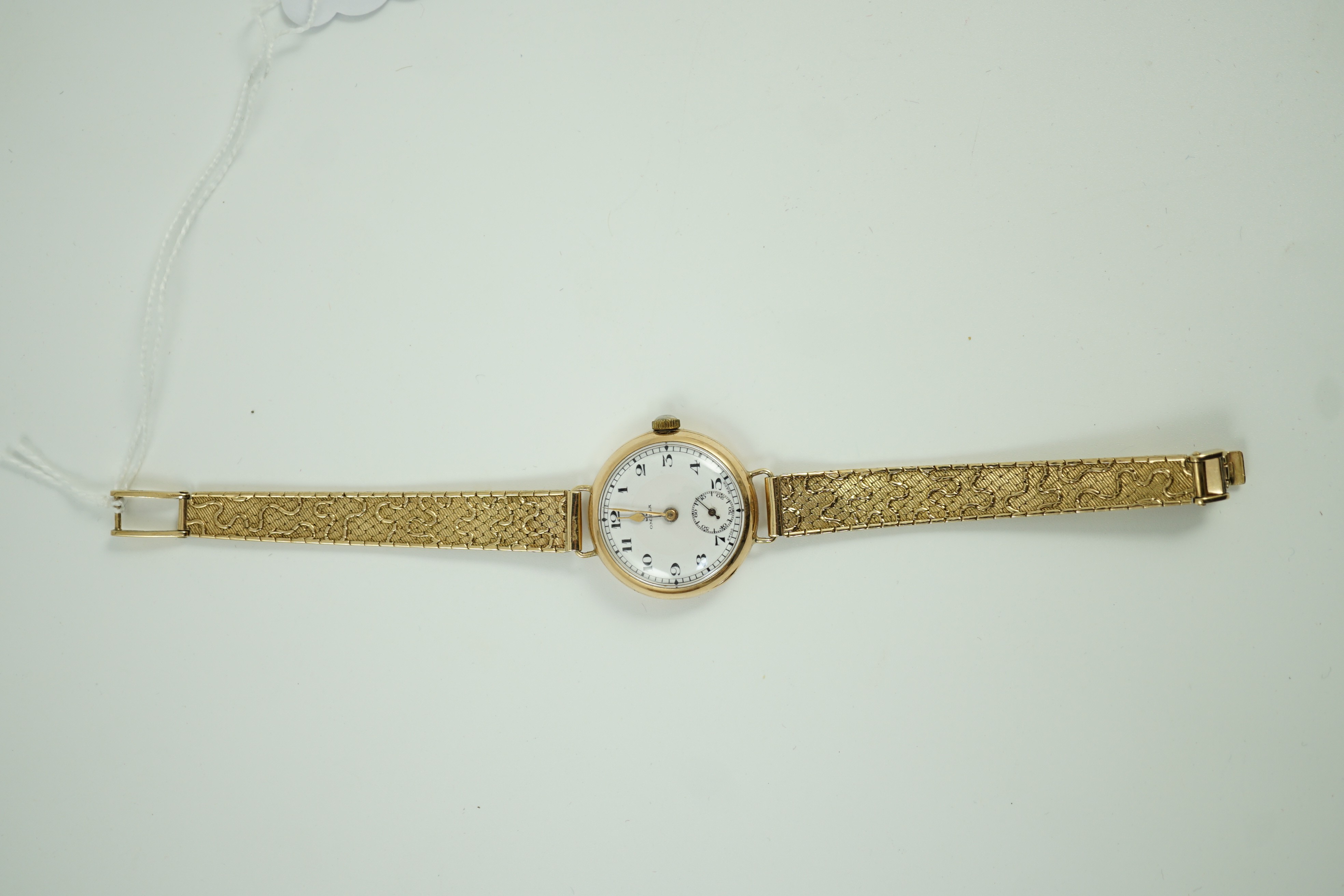 A lady's 1920's 9ct gold Omega manual wind wrist watch, on a later 9ct gold strap, overall 18.5cm, gross weight 33.2 grams.